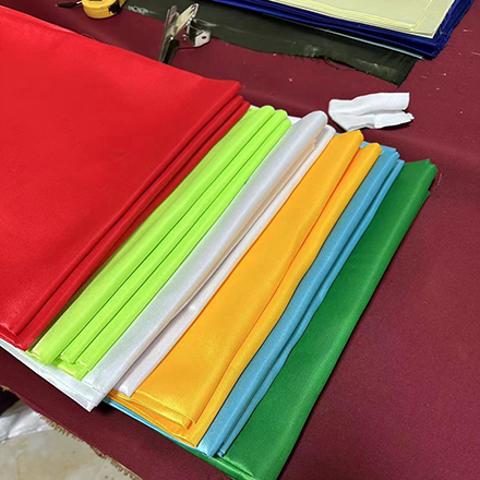 What is the difference between tribute satin and brocade satin